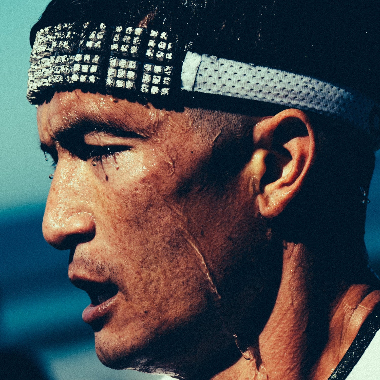 Close-up of a person wearing a headband with a blurred background